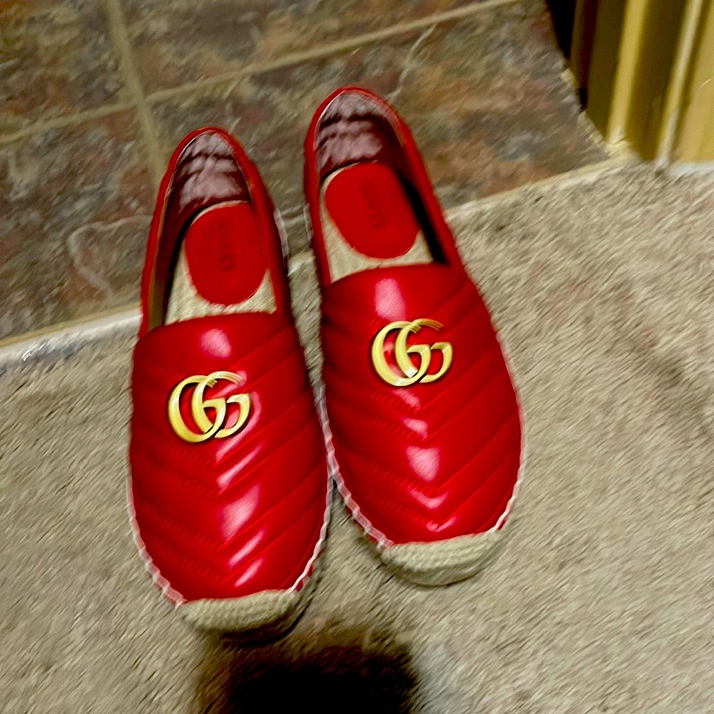 been worn  one time Gucci leather and canvas espadrilles, with brand shoe box.